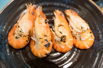 Grilled giant river prawn on black dish