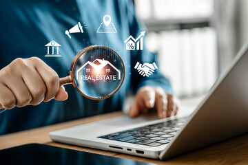 Businesswoman using magnifying glass to search and analyze virtual real estate information on laptop, property investment, digital housing market trends, financial planning, and smart business tools.