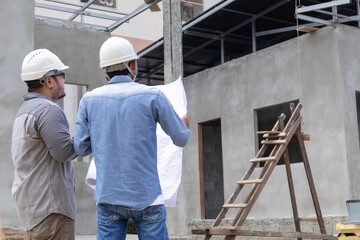 Team of Asian foremen, or head engineers construction supervisors wearing white helmet hold  blueprint inspect building in workplace site, Professional supervisors discuss or solving problem concept