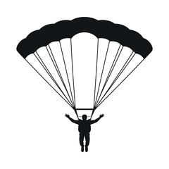 Silhouette of a skydiver under a parachute descending gracefully