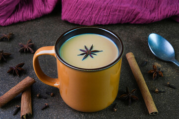 Serving masala chai in a cup.