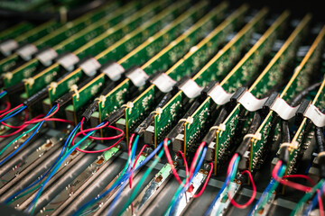 Green printed circuit boards and chips used in electronic devices, boards are in a row, close up....