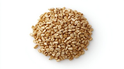 Fototapeta premium Pile of tan hulled seeds on a white surface