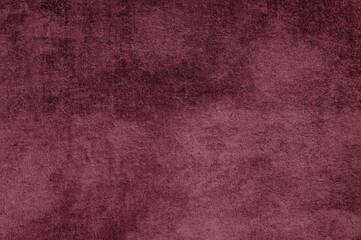 A close-up of a burgundy fabric texture, with subtle variations creating depth and interest.