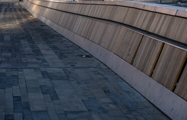 A path made of tiles with a fence.