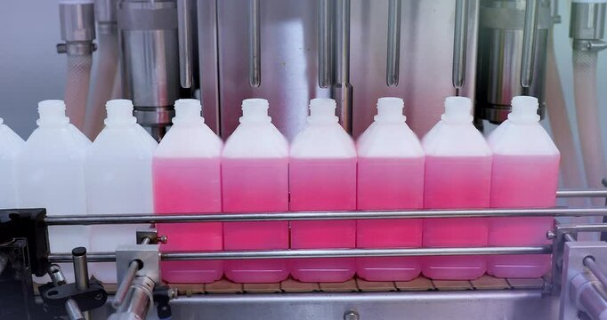 Pharmaceutical manufacturing line for liquid medicine production, automatic bottle filling machine for syrup, sanitizer, or gel in plastic bottles at sterile industrial packaging facility	