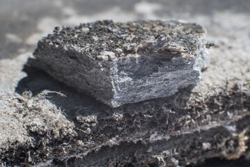 Detailed photography of building material with asbestos fibres. Health harmful and hazards effects.