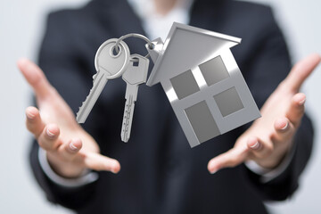 Image of a real estate agent offering house keys, symbolizing homeownership and new beginnings.