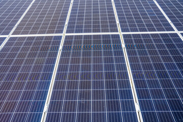 Close up of solar panels under bright sunlight with visible sun glare in Altai Russia Renewable...