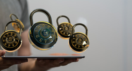 Secure your data!  Image of combination locks hovering over a tablet, symbolizing online protection.