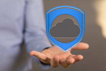 Image of a hand holding a digital shield protecting a cloud, symbolizing secure cloud data.