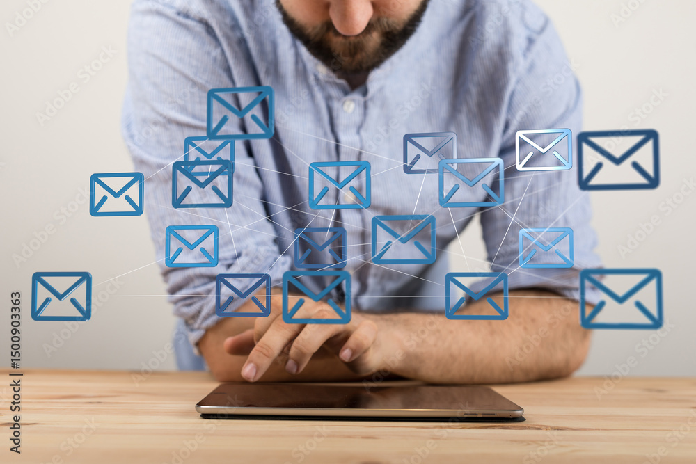 Aufkleber a man efficiently manages numerous emails using a tablet, showcasing seamless communication.
