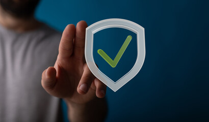 Secure your data.  This image depicts a digital shield with a checkmark, symbolizing online...