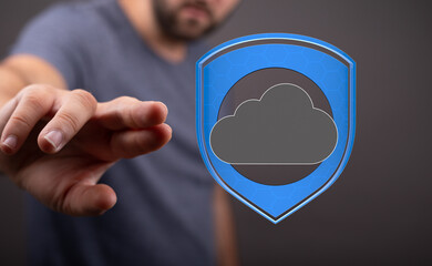 Image of a hand reaching towards a digital shield protecting a cloud, symbolizing secure cloud data...