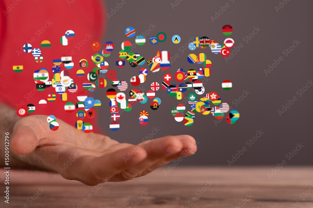Poster Image of many national flags floating above an open hand, symbolizing global unity and connection.