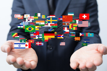 Image of diverse flags connected, symbolizing global partnerships and international business.