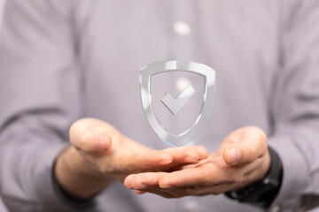 Image of hands holding a digital shield.  Perfect for cybersecurity, insurance, and data protection...
