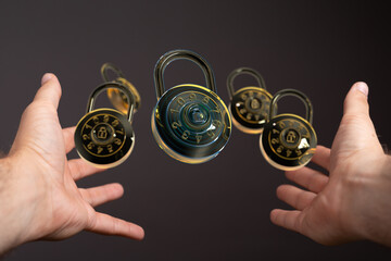 Image of multiple combination locks floating between hands, symbolizing data security and protection.