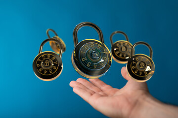 Safeguarding information: Multiple combination locks floating above a hand, symbolizing digital...