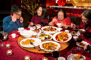 Family enjoying Chinese New Year dinner in restaurant
