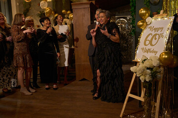 People at 60th birthday party at nightclub