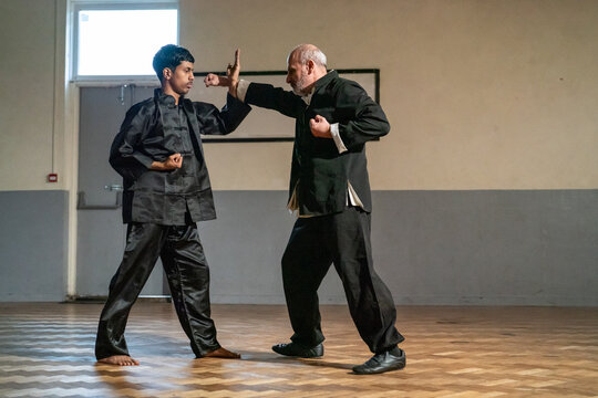 Man undergoing Kung Fu Black Belt test