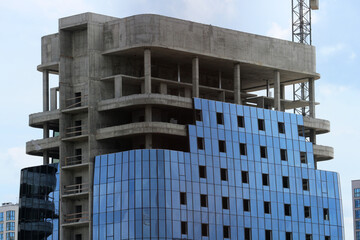 Construction of a Modern High-Rise Office Building with Glass Windows