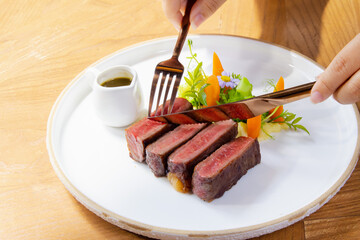 Medium Rare Wagyu Beef Steak with Sauce and Vegetables on White Plate