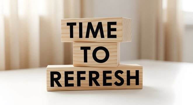 Wooden blocks spelling out 'TIME TO REFRESH', symbolizing renewal, updates, or business rejuvenation