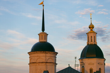 Two domed buildings with a cross on top