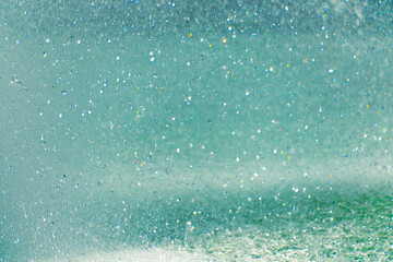 Sparkling water droplets in sunlight creating a magical effect