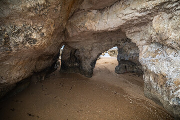Sea caves, cliffs and arches landscape in Cyprus. White stones cave cliff rocks Mediterranean sea geologic panorama