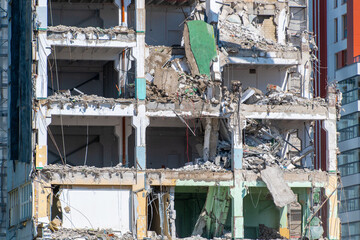 Urban building demolition: multi-story structure in destruction process
