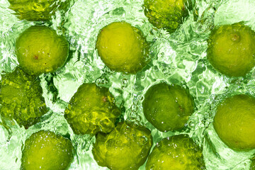 Green Limes on Water Surface Flat Lay