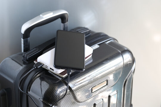 Power bank and passport on luggage for travel of holiday