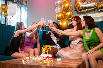 Group of female friends celebrating 21st birthday