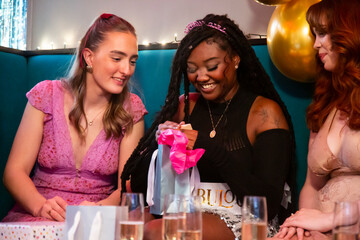 Group of female friends celebrating 21st birthday