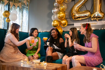 Group of female friends celebrating 21st birthday