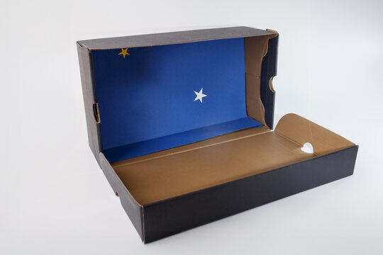 an open cardboard box with a striking blue interior. Inside, two stars stand out. recycling idea, simple material for DIY project and creative craft for kids. how to make diorama for Christmas,