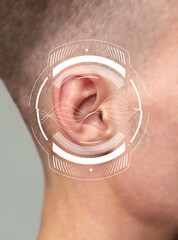 Close-up view of a person's ear with sound wave graphics illustrating hearing concept