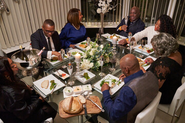Group of friends dining while celebrating wedding anniversary