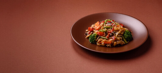 Chinese or Thai food, rice noodles with meat, salt and spices. Asian food