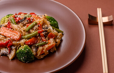 Chinese or Thai food, rice noodles with meat, salt and spices. Asian food