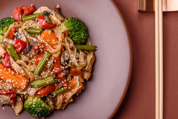 Chinese or Thai food, rice noodles with meat, salt and spices. Asian food