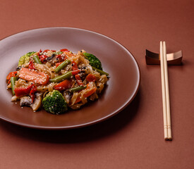 Chinese or Thai food, rice noodles with meat, salt and spices. Asian food