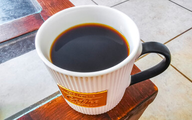 Cup of americano black coffee in restaurant cafe in Mexico.