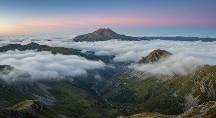 Aerial Photo of Mountain Peaks above the Clouds under a Colorful Sky Photo