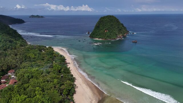Aerial drone view of red island east java indonesia tropical beach surfers ocean waves