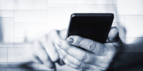 Woman's hands using a mobile phone, geometric pattern