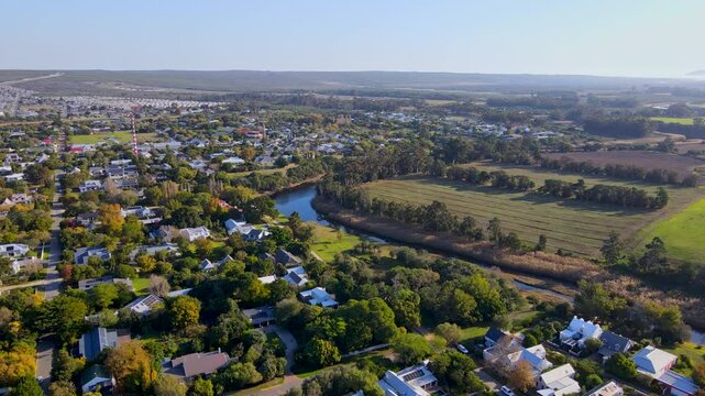 Charming Overberg countryside town of Stanford next to Klein River, sunset drone
